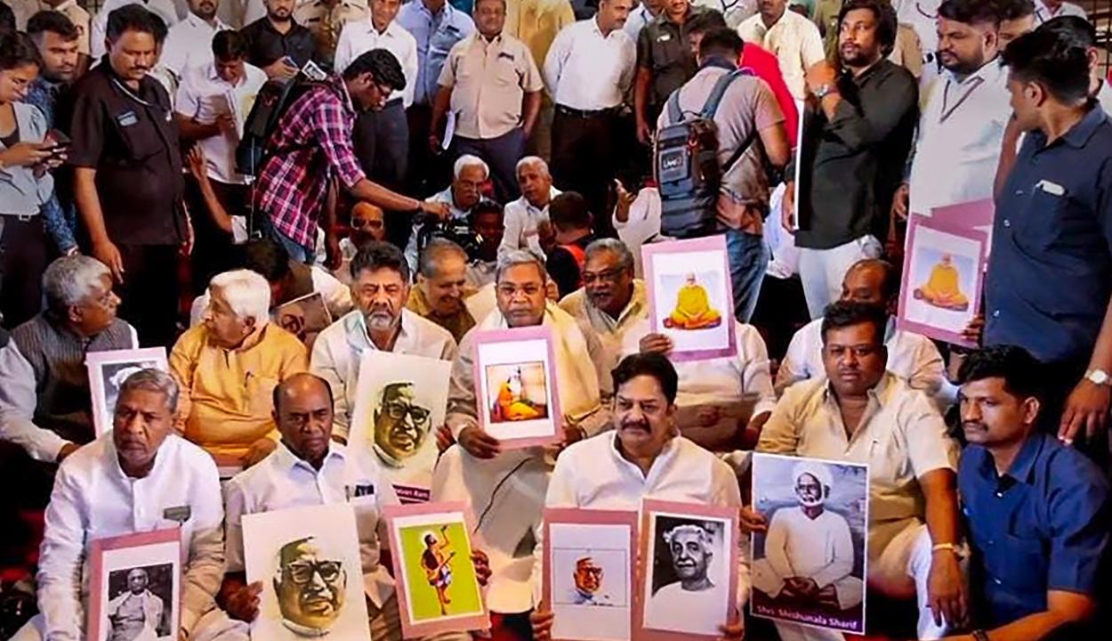 Congress leaders Siddaramaiah, DK Shivakumar and others stage a protest after a portrait of Hindutva ideologue Veer Savarkar was unveiled during Winter Session of Karnataka Assembly. Pic/PTI